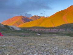 07A The slope of ITMO University Peak blazes red and orange at sunset from Ak-Sai Travel Lenin Peak Base Camp 3600m